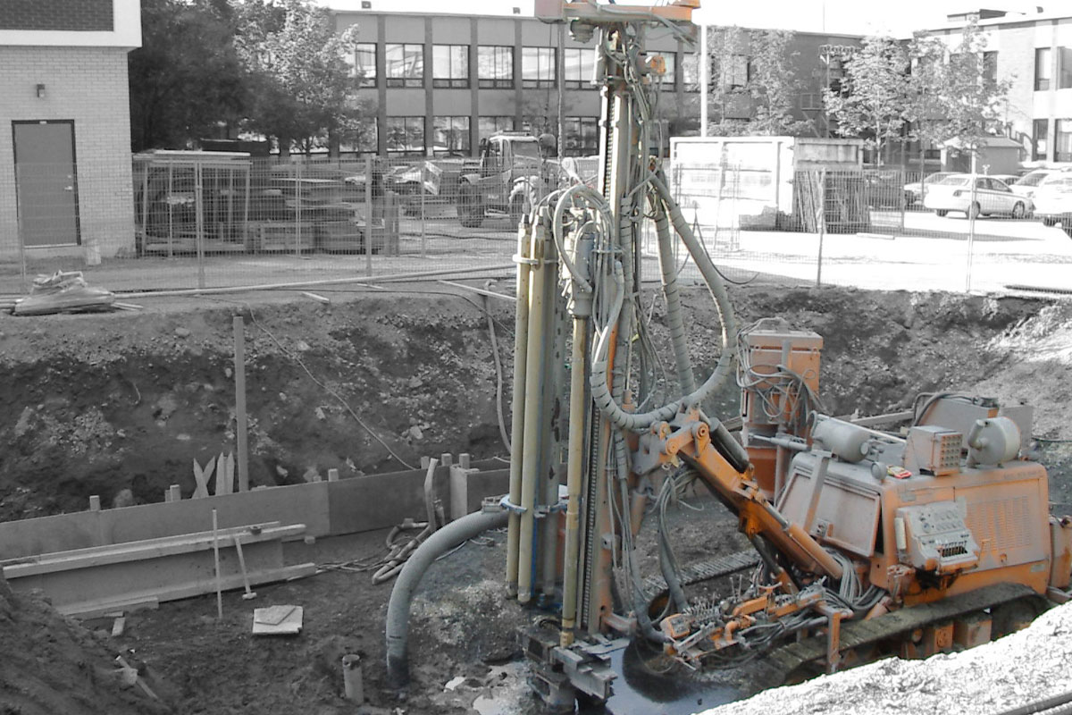 A machine digging on a contruction site.