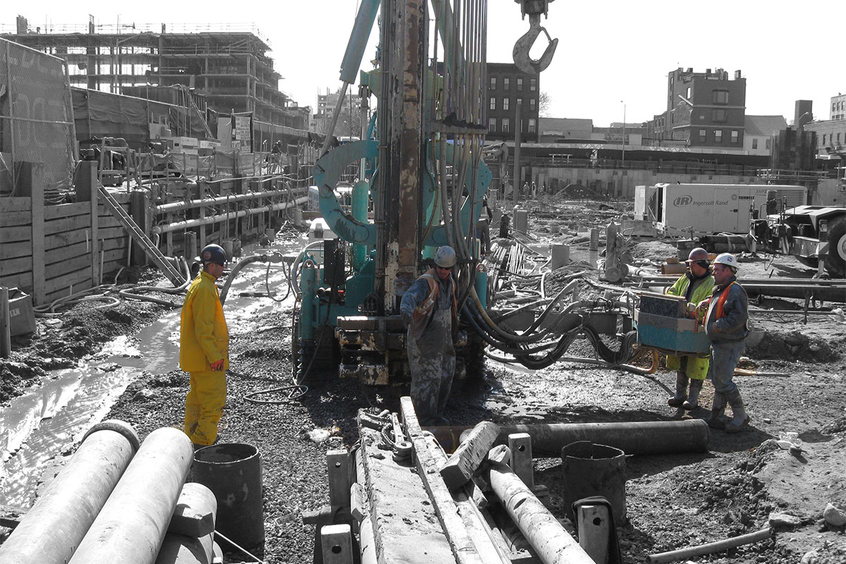 A team preparing to dig on a contruction site.